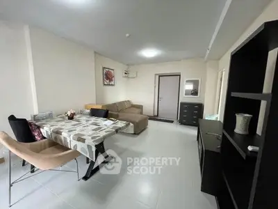 Spacious living room with modern furniture and elegant decor in a cozy apartment.
