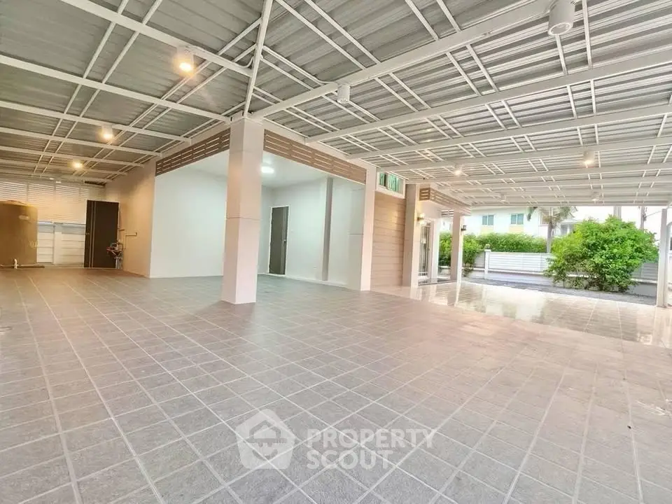 Spacious covered parking area with modern design and ample lighting