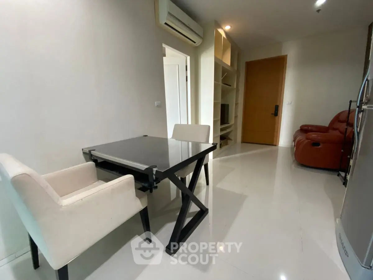 Modern living room with sleek furniture and air conditioning in a stylish apartment.