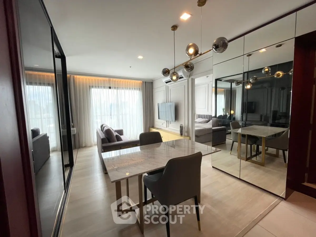 Luxurious modern living room with elegant dining area and floor-to-ceiling windows.