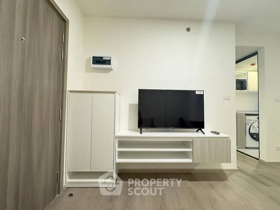 Modern living room with sleek TV setup and stylish storage solutions