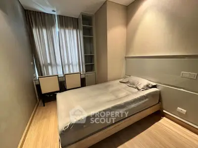 Cozy modern bedroom with natural light and stylish furnishings