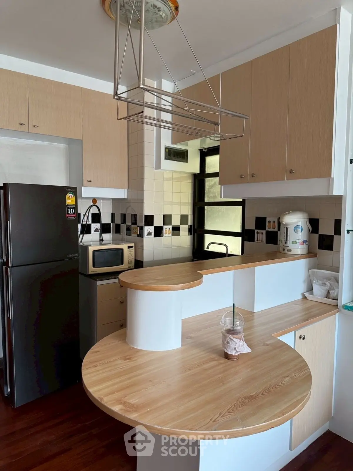 Modern kitchen with wooden countertops and sleek appliances