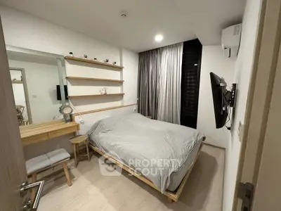 Modern bedroom with minimalist design, featuring a cozy bed, wall-mounted TV, and stylish shelving.