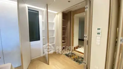 Modern interior with sleek storage solutions and elegant wooden flooring