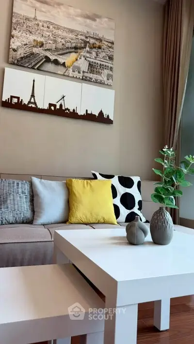 Stylish living room with modern decor and cityscape artwork