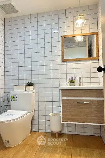 Modern bathroom with stylish vanity and elegant lighting