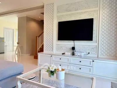 Elegant living room with modern TV setup and stylish decor