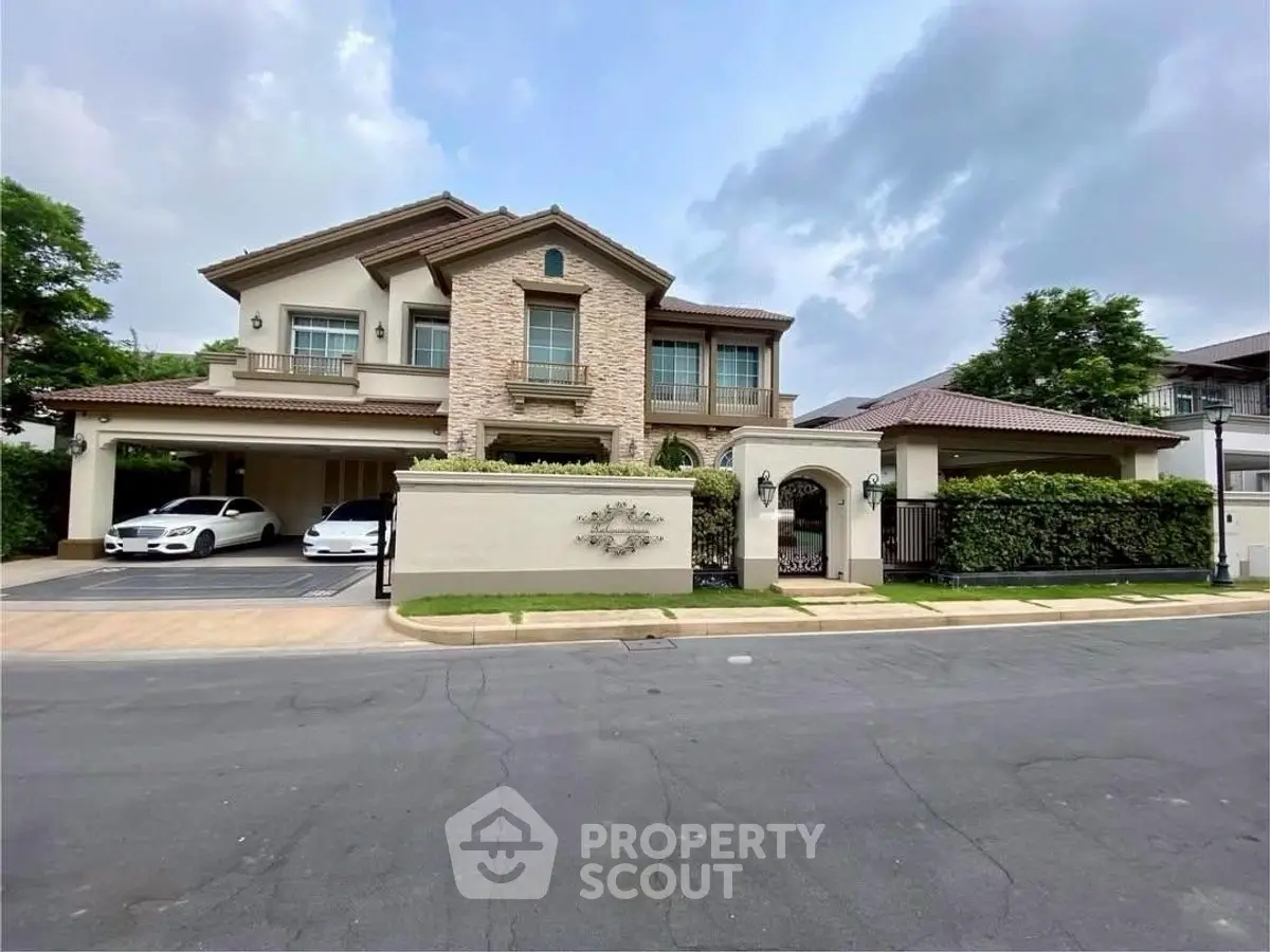 Luxurious two-story house with elegant facade and spacious driveway