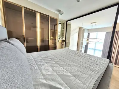 Modern bedroom with sleek design and mirrored wardrobe doors