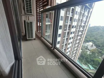 Spacious balcony with stunning city view in modern high-rise building
