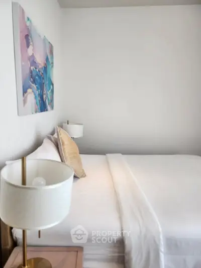 Modern bedroom with stylish decor and cozy bedding