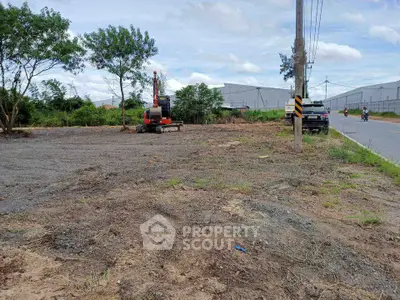 Vacant land with construction equipment, ideal for development opportunities.