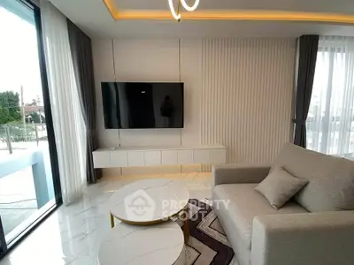 Modern living room with sleek TV setup and elegant furniture