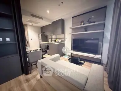 Modern living room with sleek furniture and open kitchen layout