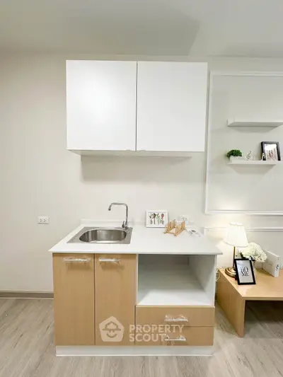 Modern compact kitchen with sleek cabinetry and minimalist design