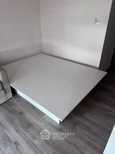 Modern minimalist living room with sleek platform and stylish flooring