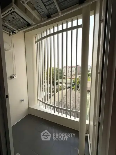 Spacious balcony with city view and modern railing design