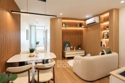 Modern living room with elegant wooden paneling and cozy seating area