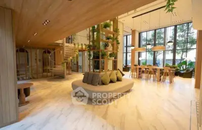 Luxurious modern living room with high ceilings, elegant decor, and large windows offering stunning views.