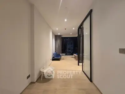 Spacious modern living room with open layout and large windows for natural light.