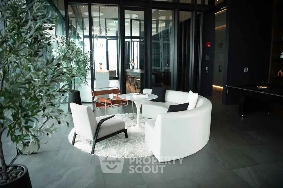 Luxurious modern living room with elegant furniture and floor-to-ceiling windows