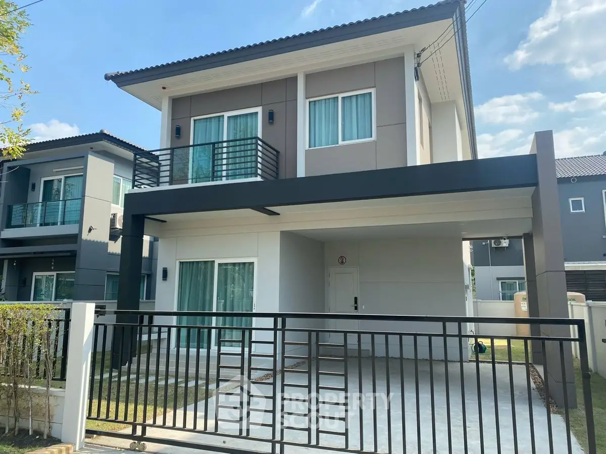 Modern two-story house with sleek design and spacious driveway