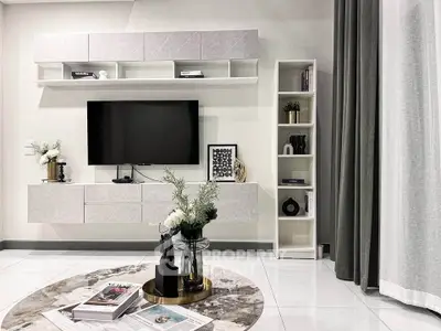Modern living room with sleek TV setup and stylish decor