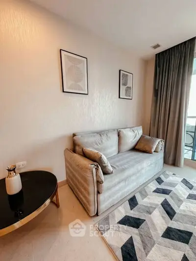 Modern living room with stylish sofa and geometric rug