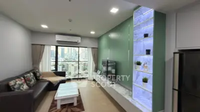 Modern living room with city view, stylish decor, and comfortable seating in a high-rise apartment.