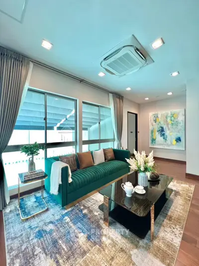 Luxurious living room with modern decor, plush sofa, and elegant artwork, perfect for stylish urban living.