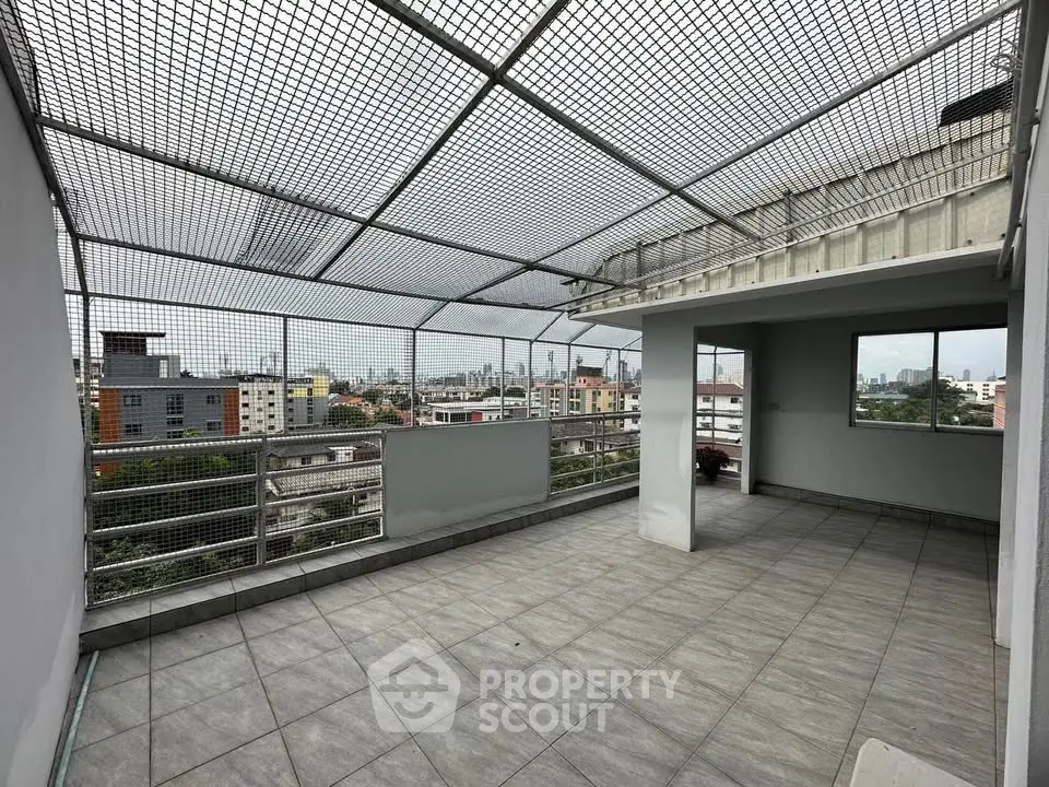 Spacious rooftop terrace with city views, perfect for entertaining and relaxation.