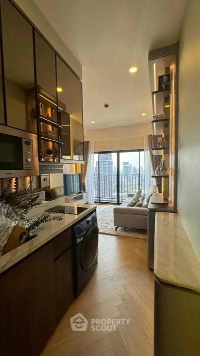 Modern open-plan kitchen and living room with city view balcony