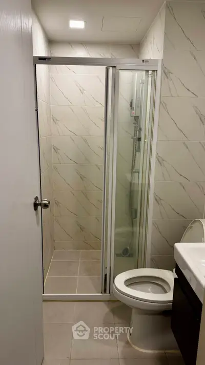 Modern bathroom with sleek shower and elegant tile design