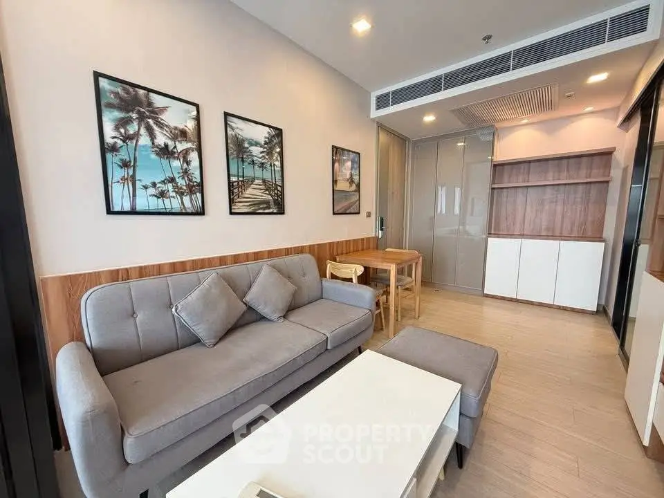 Modern living room with stylish decor and cozy furniture in a contemporary apartment.