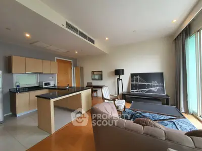 Spacious open-plan living room with modern kitchen and stylish decor