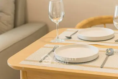 Elegant dining setup with modern tableware in cozy living space