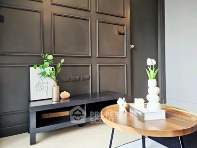 Stylish modern living room with elegant decor and wooden accents.