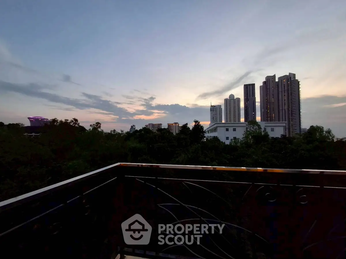 Stunning city skyline view from a balcony at dusk, perfect for urban living enthusiasts.