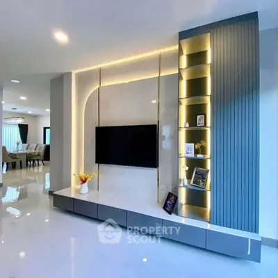 Modern living room with sleek TV unit and elegant lighting