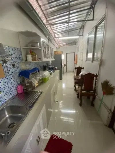 Cozy kitchen with modern appliances and open layout, perfect for culinary enthusiasts.