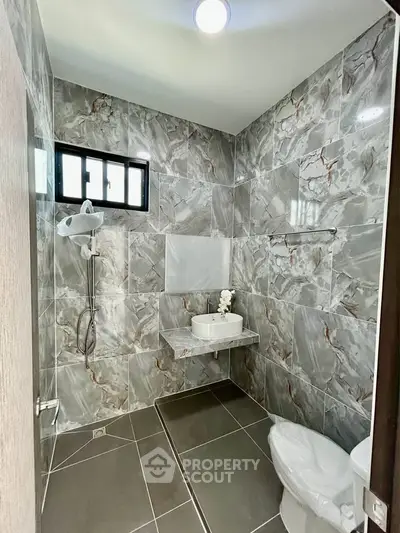 Modern bathroom with elegant marble tiles and sleek fixtures