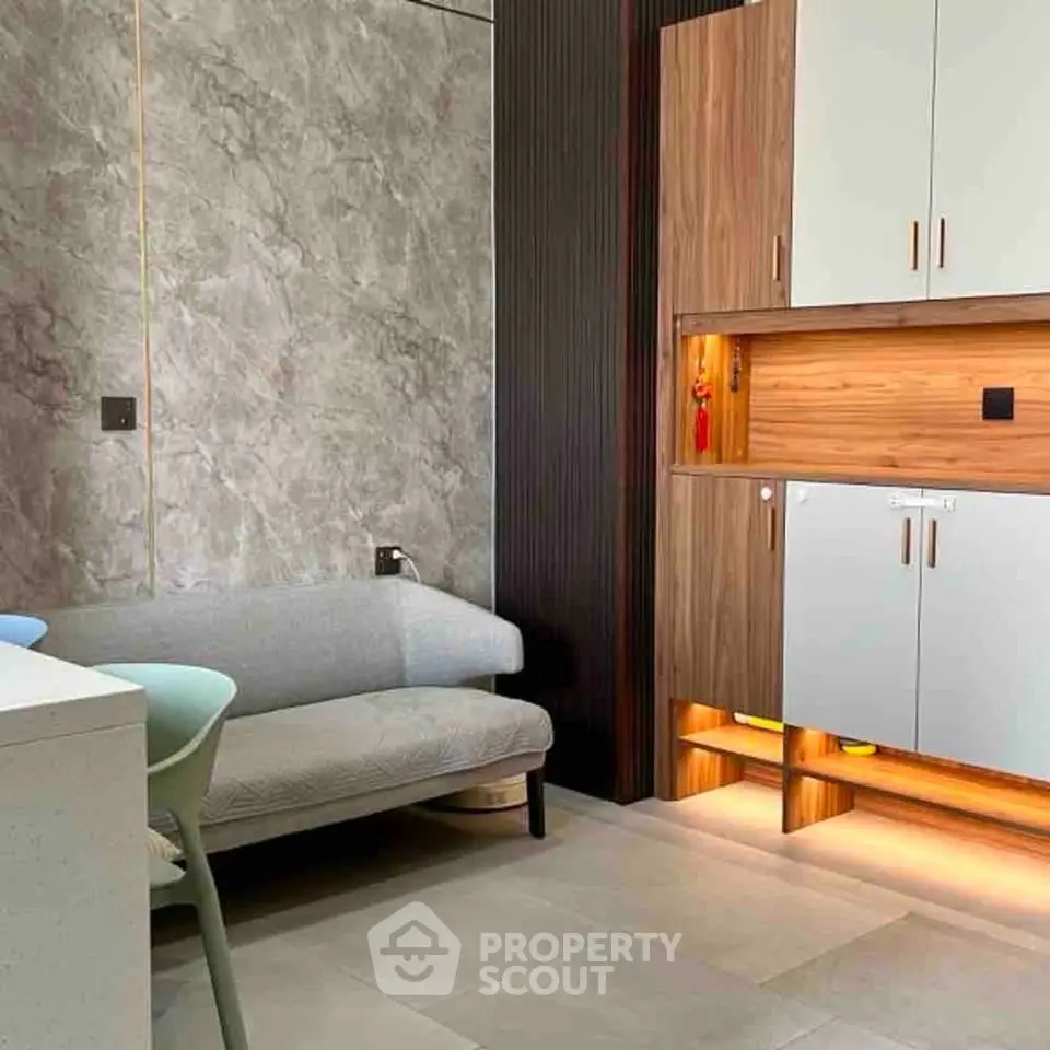 Modern living room with stylish furniture and elegant cabinetry