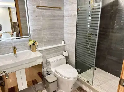 Modern bathroom with sleek shower and elegant fixtures