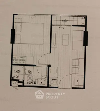 Compact apartment floor plan with bedroom, living area, kitchen, and bathroom layout.