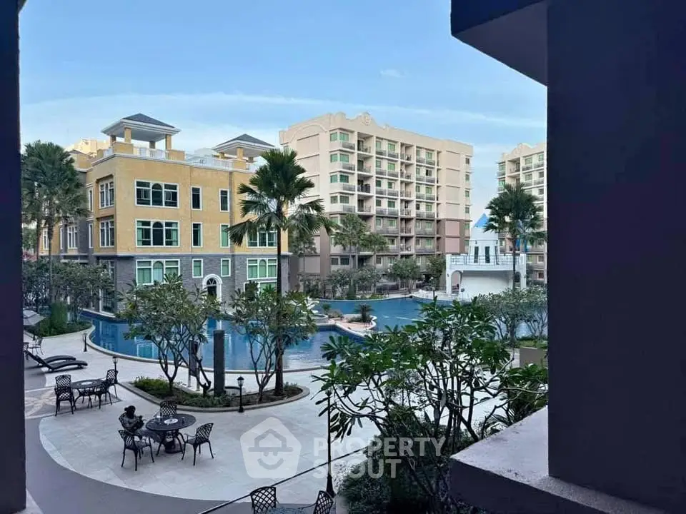 Luxurious residential complex with pool and lush landscaping, offering a serene and upscale living environment.