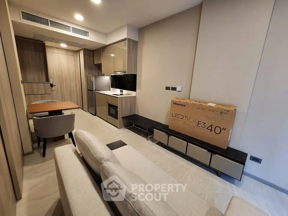 Modern apartment living room with open kitchen and stylish furniture