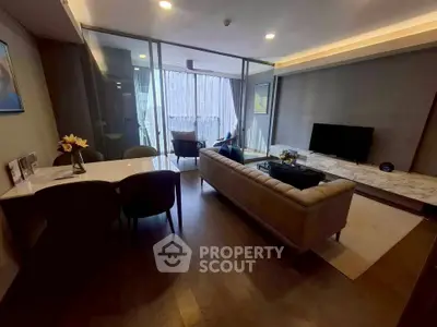 Modern living room with elegant decor and large windows in a luxury apartment.