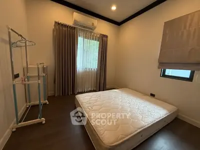 Cozy bedroom with mattress and natural light, ideal for restful nights.