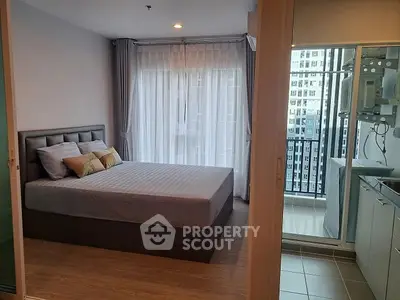 Modern bedroom with balcony view in high-rise apartment